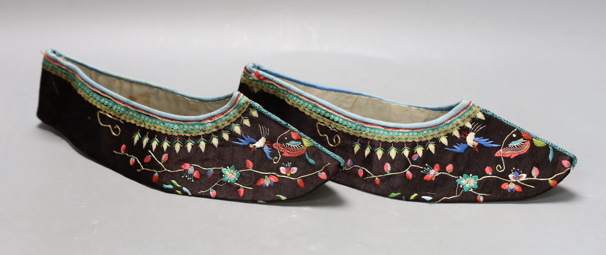 A pair of Chinese embroidered silk shoes, upper section only